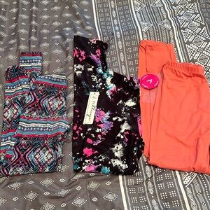 3 pairs of leggings. 2 new with tags 1 gently used